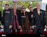 Unveiling the Enchanting Harmony of Phil Collen and Helen L. Simmons